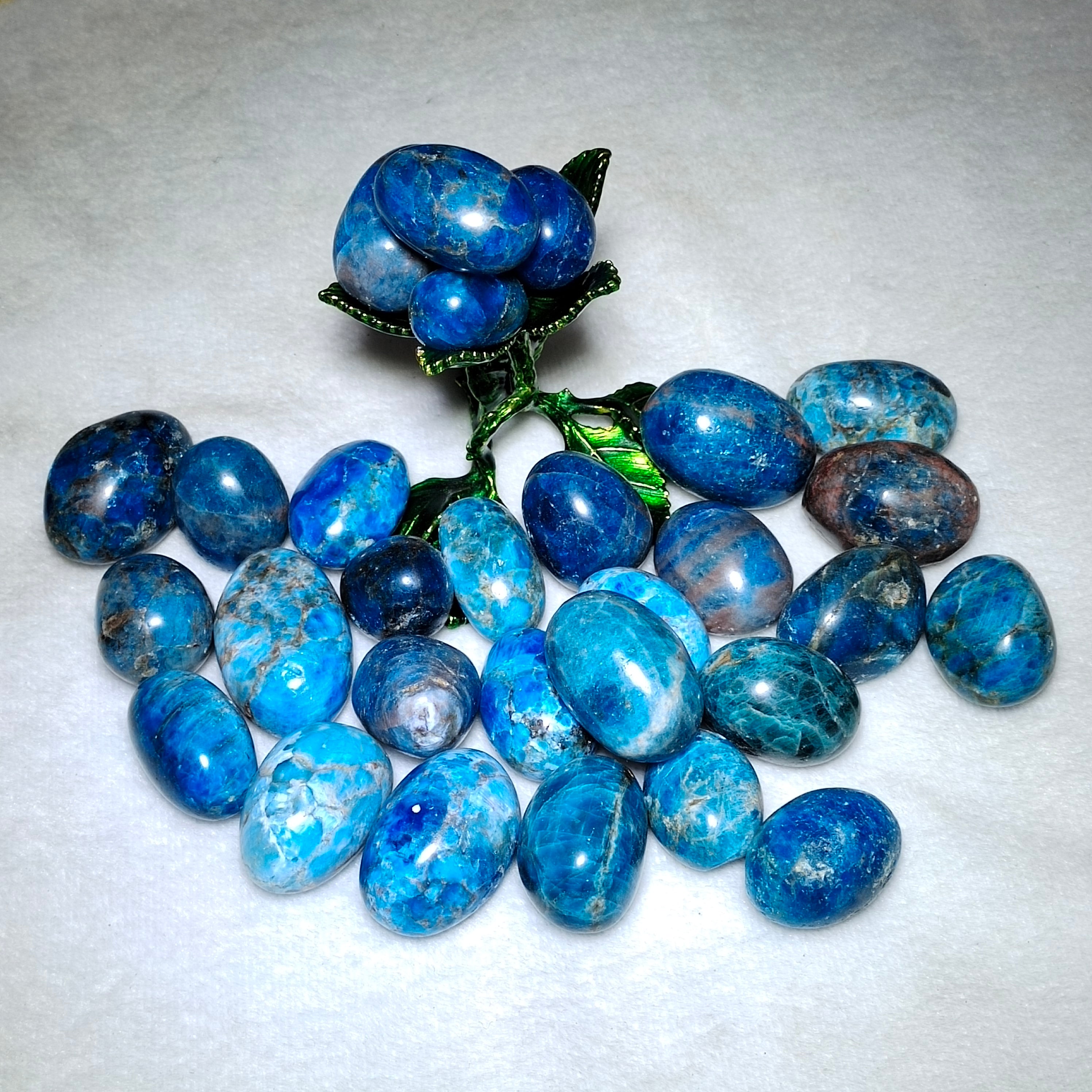 Blue apatite tumbles