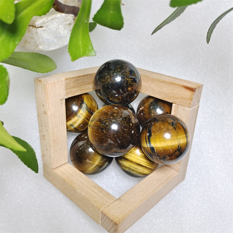 Yellow tiger eye stone sphere