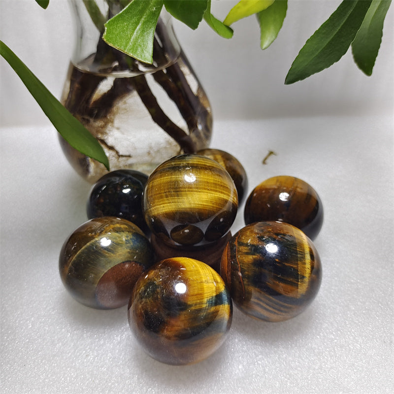 Yellow tiger eye stone sphere