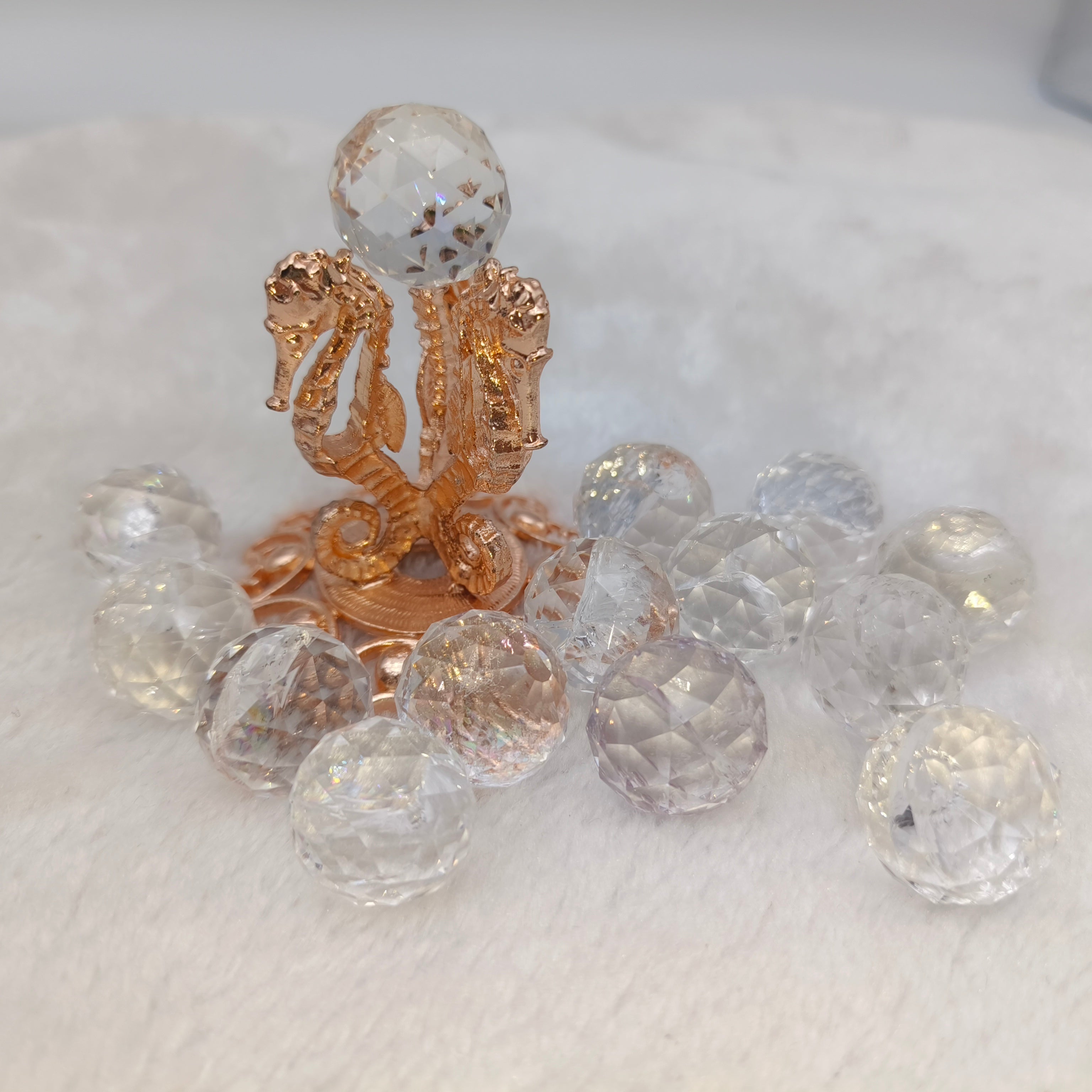 Crystal faceted spheres in various materials