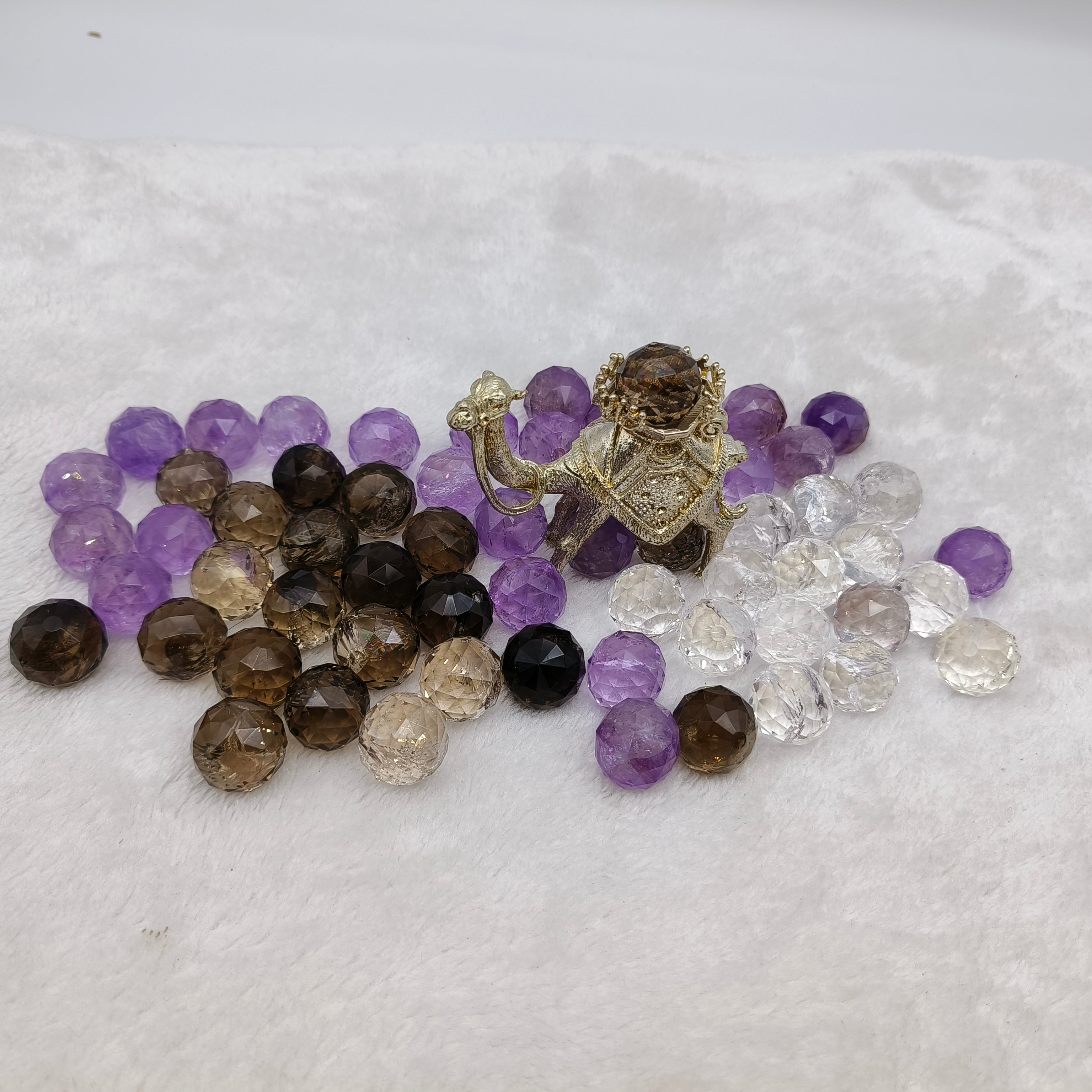 Crystal faceted spheres in various materials