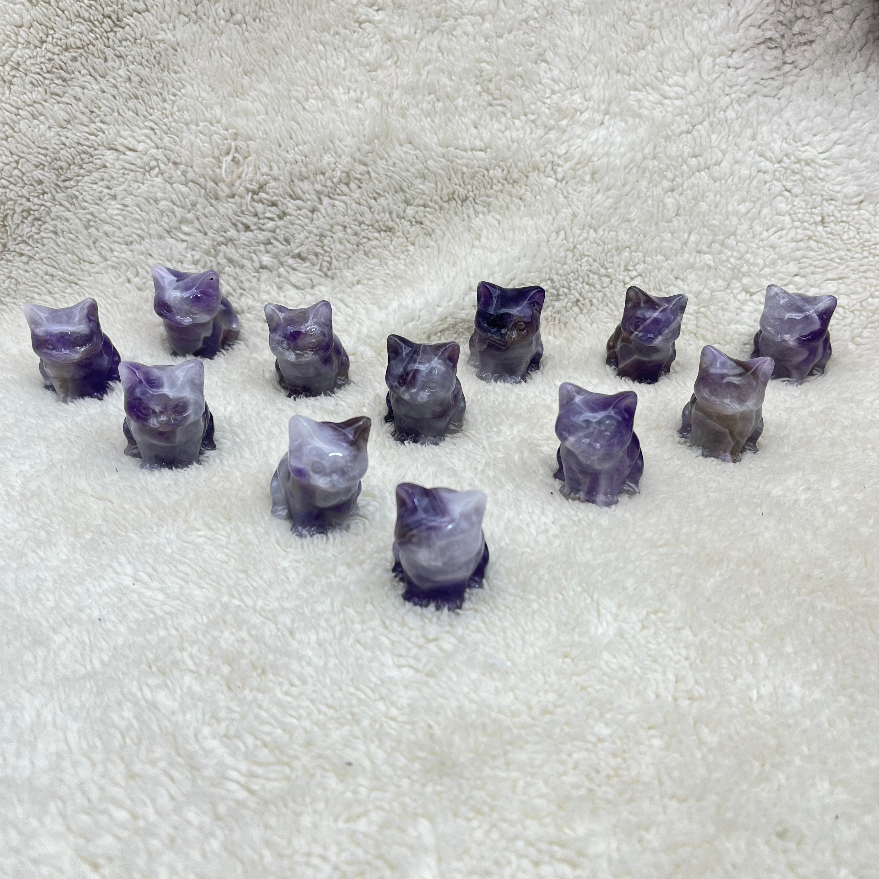The cat sitting on the dreamy amethyst