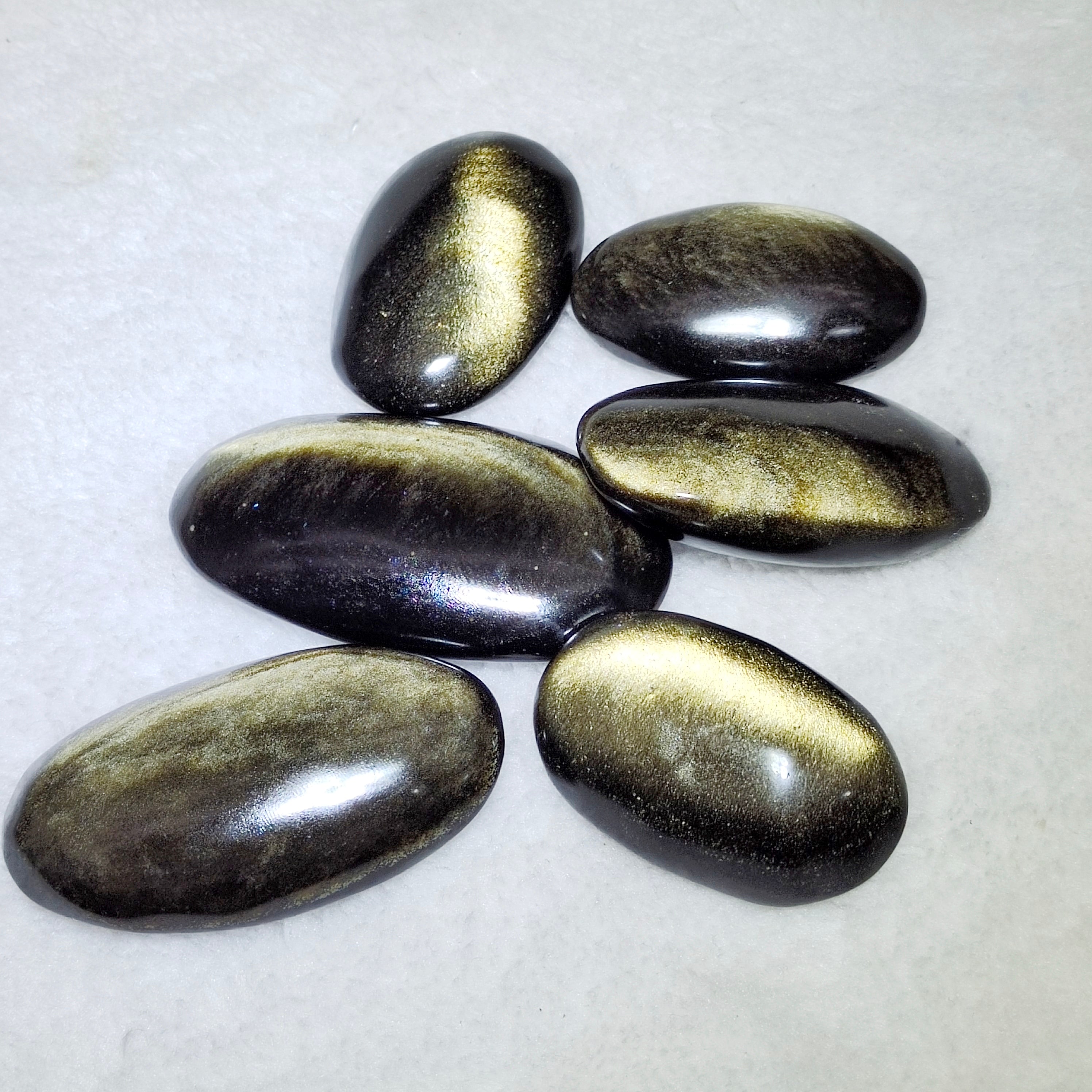 Golden obsidian palmstone