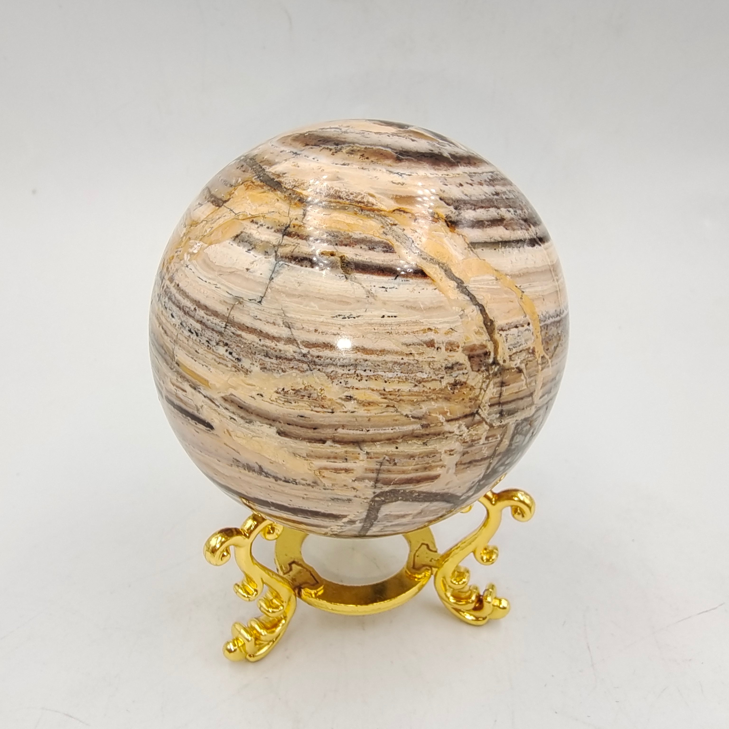 Woodgrain stone sphere