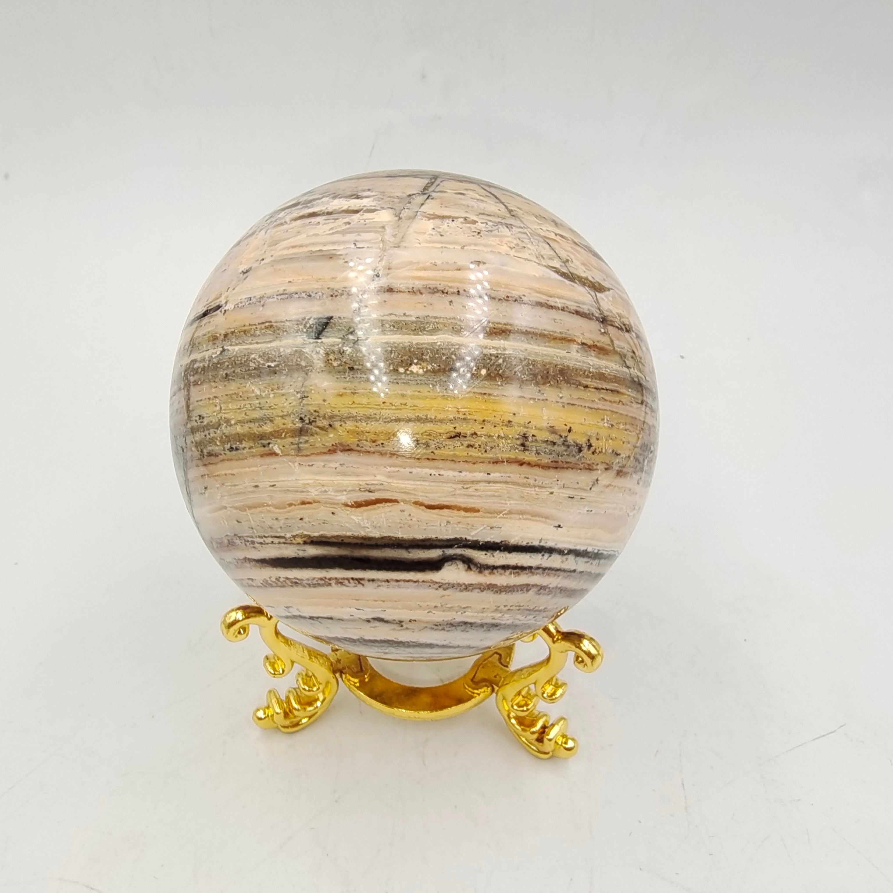 Woodgrain stone sphere