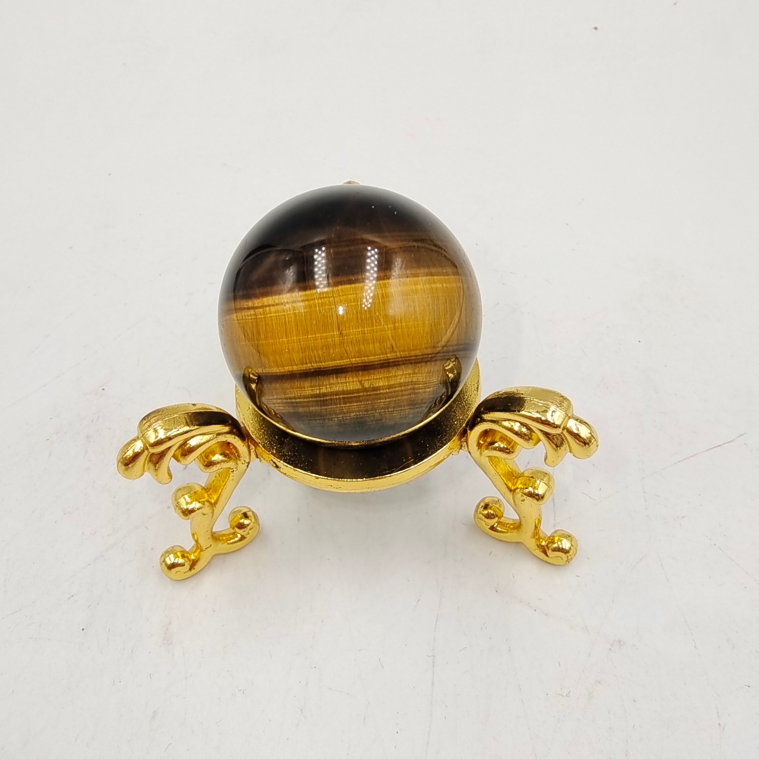 Yellow tiger eye stone sphere